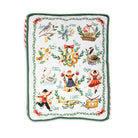 A square decorative cushion cover featuring a white background with a colorful Christmas-themed illustration, surrounded by a green leaf border and red-and-white striped piping.