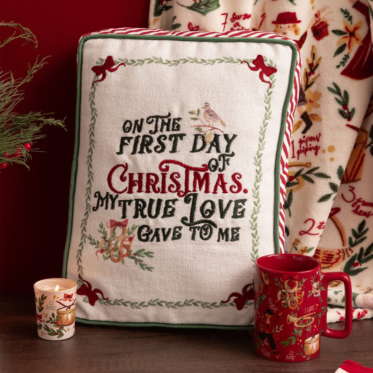 embroidered 'on the first day of christmas my true love gave to me' with green piping detail