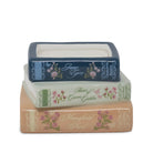 Three stacked book-shaped decorative boxes with floral designs and titles including Jane Eyre, Anne of Green Gables, and Mansfield Park, on a white background.