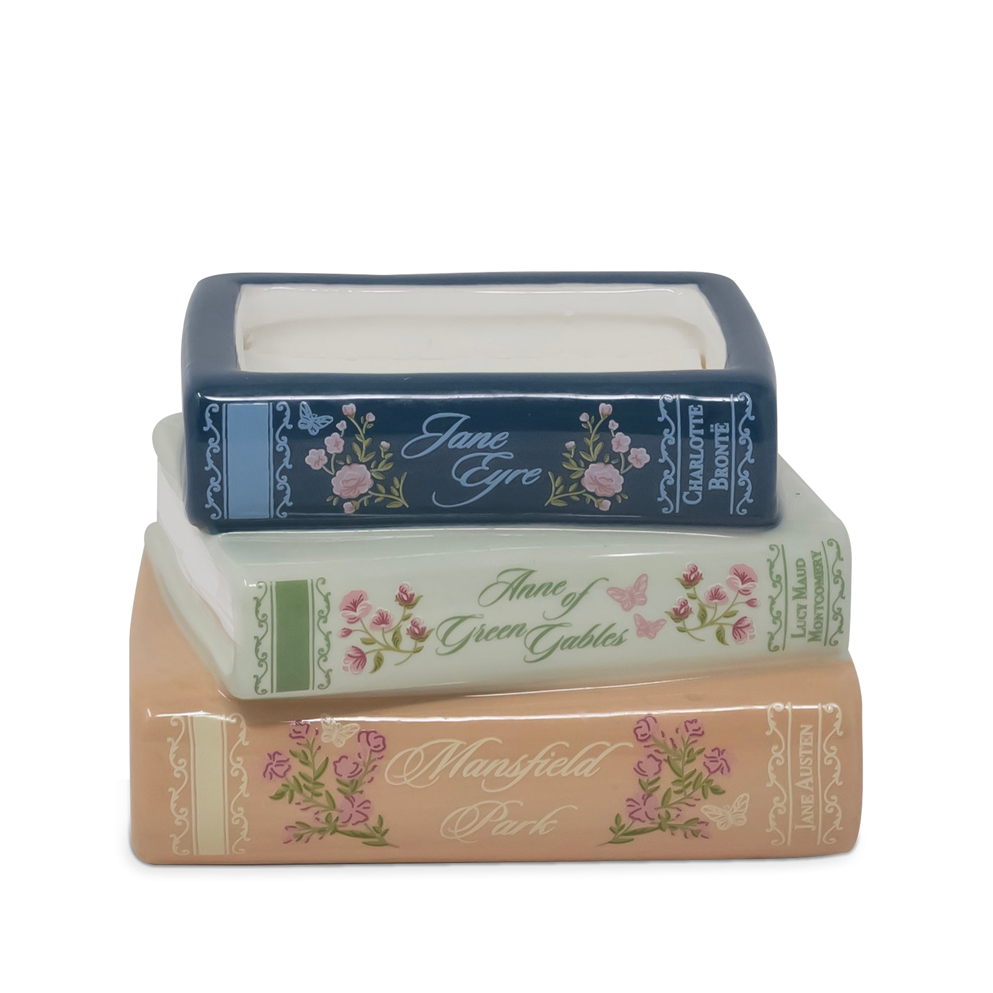 Three stacked book-shaped decorative boxes with floral designs and titles including Jane Eyre, Anne of Green Gables, and Mansfield Park, on a white background.