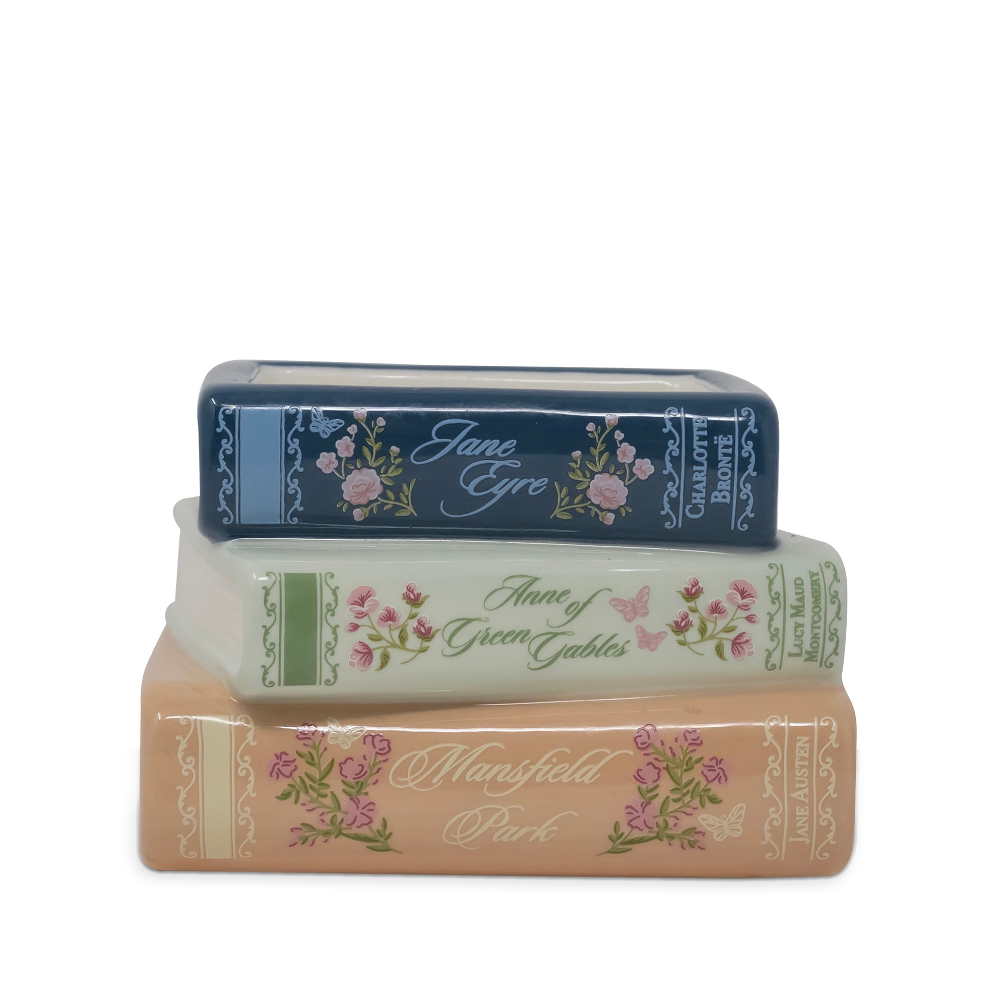 Three decorative book-shaped items stacked vertically on a white background, featuring floral designs and titles including Jane Eyre, Anne of Green Gables, and Mansfield Park.