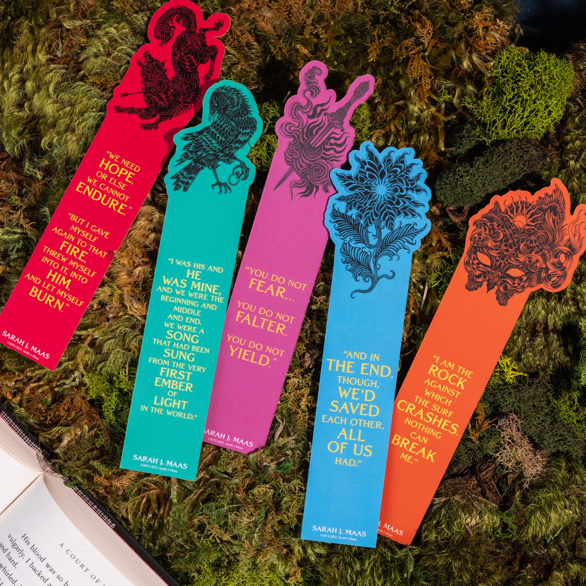 Colorful bookmarks with literary quotes on a textured green background