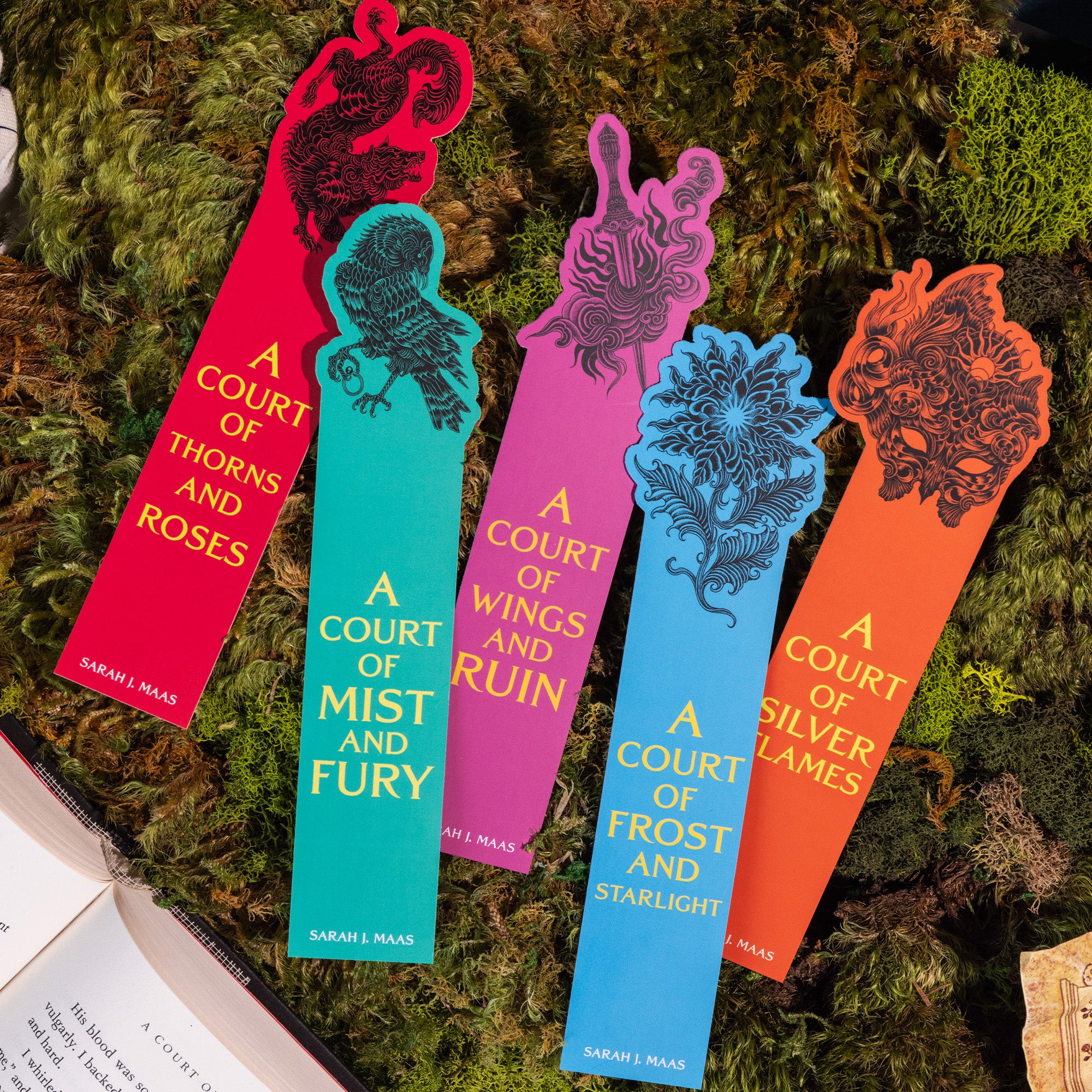Colorful bookmarks with book titles on a textured green background