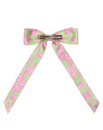 Hair bow with pink floral pattern on a white background
