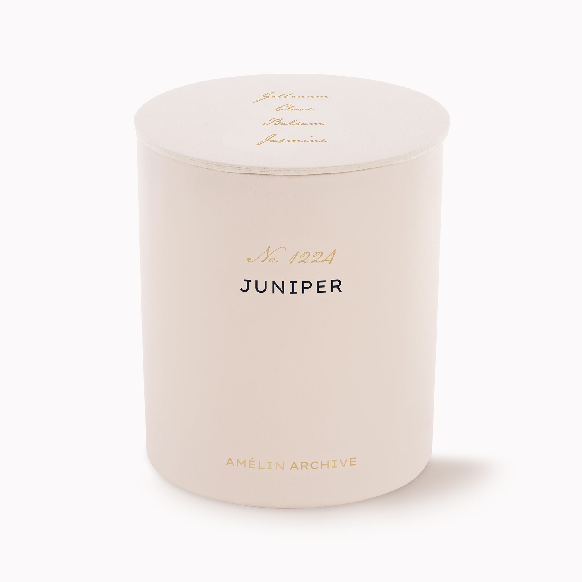 A cylindrical candle in a matte cream-colored jar with a matching lid, featuring gold and black text on the front and lid. The brand 'Amélin Archive' is printed at the bottom, and the scent 'Juniper' is labeled in black.