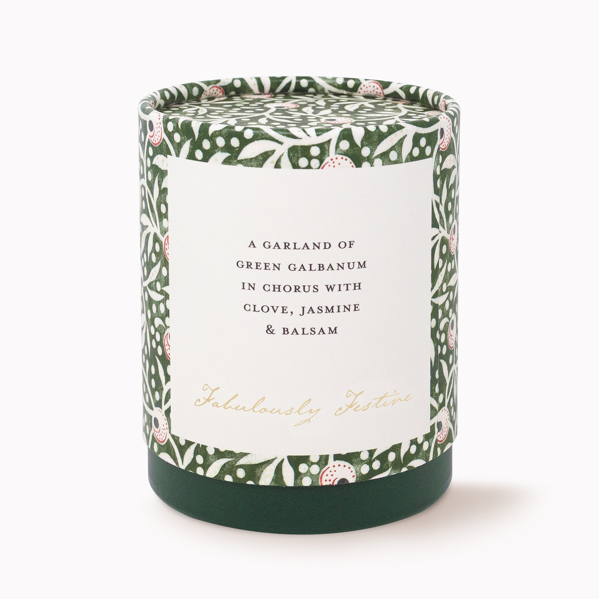 A cylindrical scented candle in a dark green jar with a white label reading 'A GARLAND OF GREEN GALBANUM IN CHORUS WITH CLOVE, JASMINE & BALSAM' and 'Fabulously Festive' in gold script. The lid and sides feature a green botanical pattern with small pink and white floral accents, set against a clean white background.