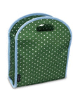 Green polka dot bag with blue trim on a white background