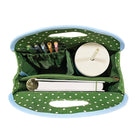 interior of Green polka dot bag with blue trim on a white background