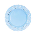 Light blue plate with decorative woven rim on a white background