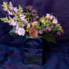 back view of Book-shaped vase with 'Velaris' design with a bouquet inside