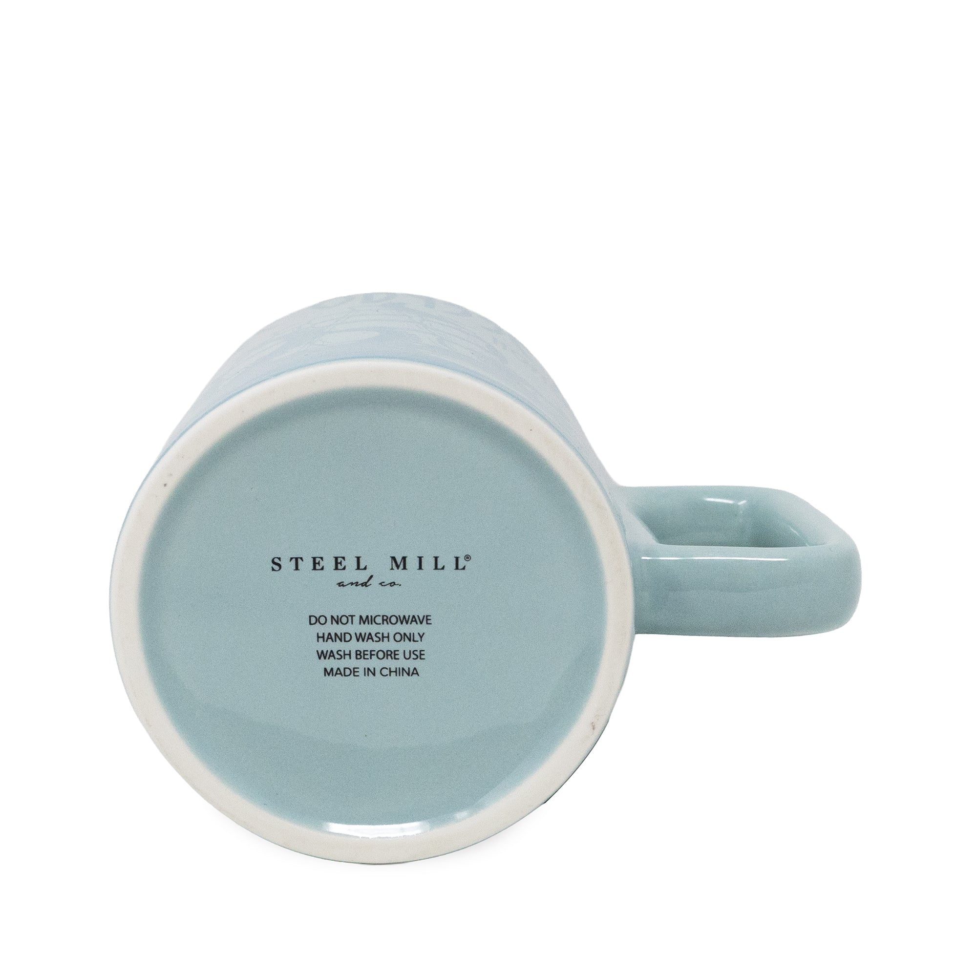 Light blue mug with 'Steel Mill' branding and washing instructions on a white background