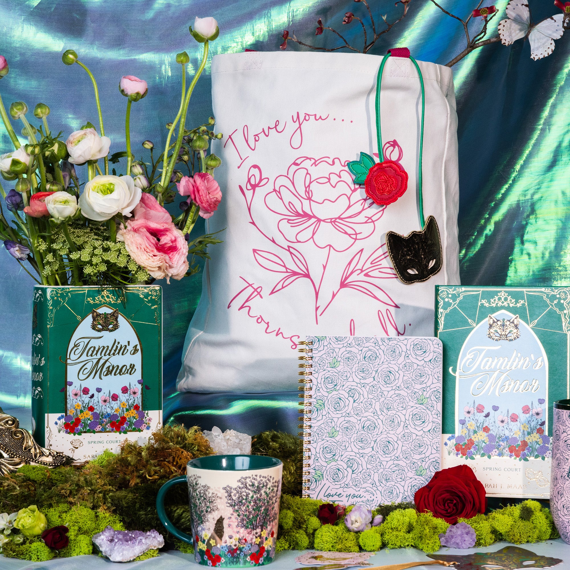 Mug with floral design surrounded by other tamlin's manor themed items