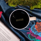 interior 'STAY WITH THE HIGH LORD' of Beige mug with mountain and tree design and 'Suriel Trading Co.' text 