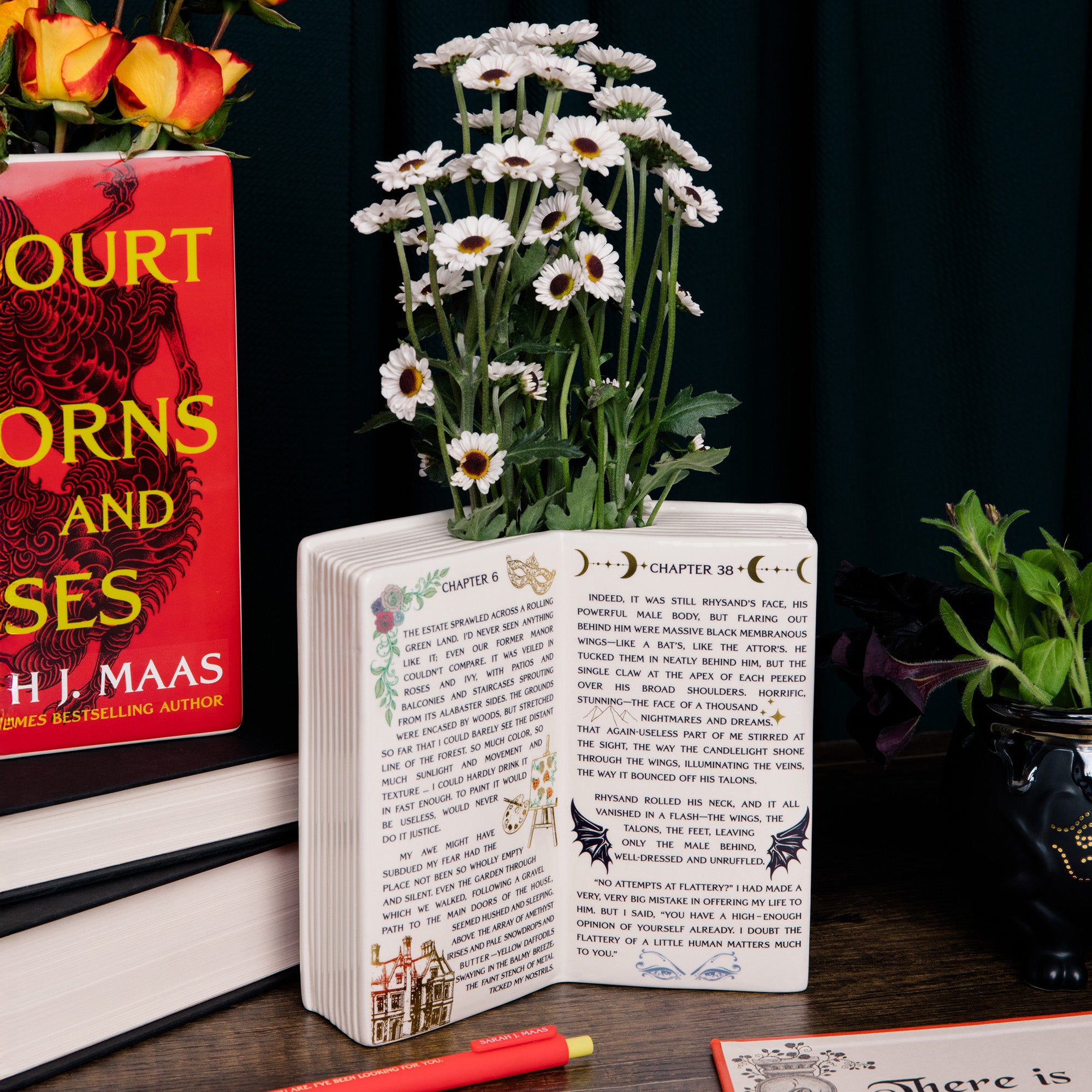 Open book vase with interior chapter of SJM book