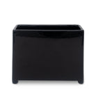back view of black planter with floral and fiery designs on a white background