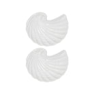 Two white shell-shaped plates on a white background