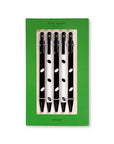 Set of black and white polka dot pens in a green box with 'kate spade' branding.