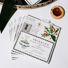 square paper napkins from The Christmas Chronicle, featuring vintage holiday illustrations, text snippets, and festive designs on a white table surrounded by holiday items