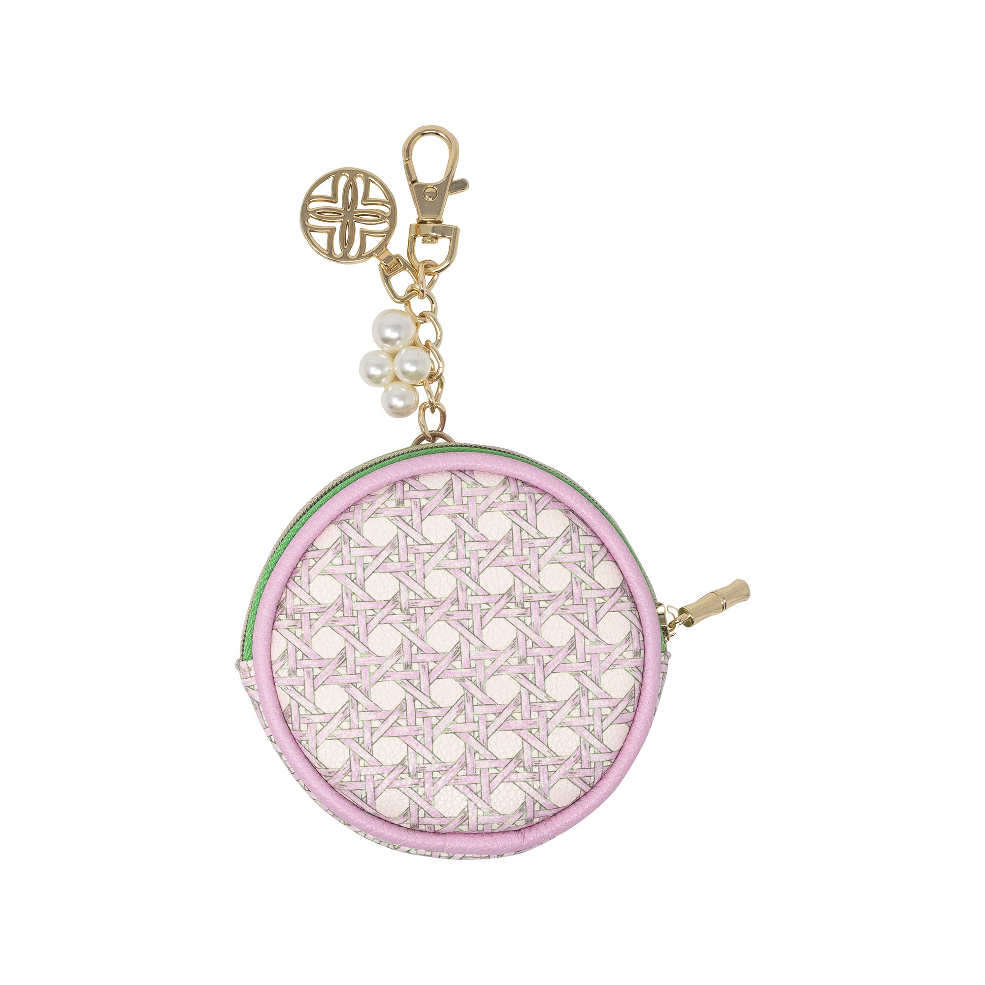 A small round coin purse with a light pink and white geometric pattern, a light green trim, and gold-tone hardware including a clasp, charm, and zipper pull.