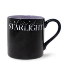 Black mug with 'City of Starlight' text on a white background