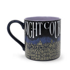 Mug with 'Night Court' text and cityscape design on a white background