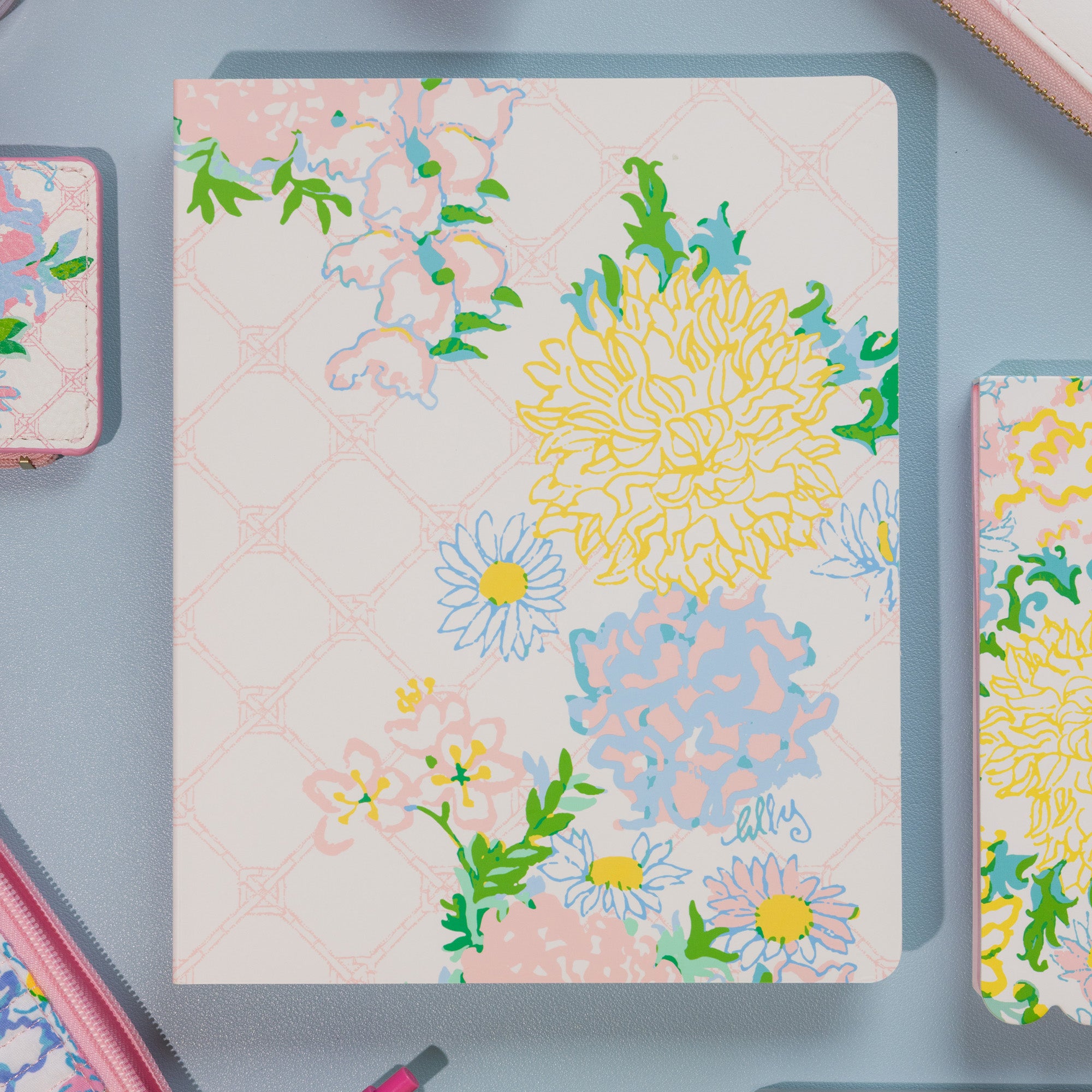 Floral patterned notebook on a gray surface