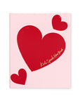 Red heart design with 'Kate Spade New York' on a pink background