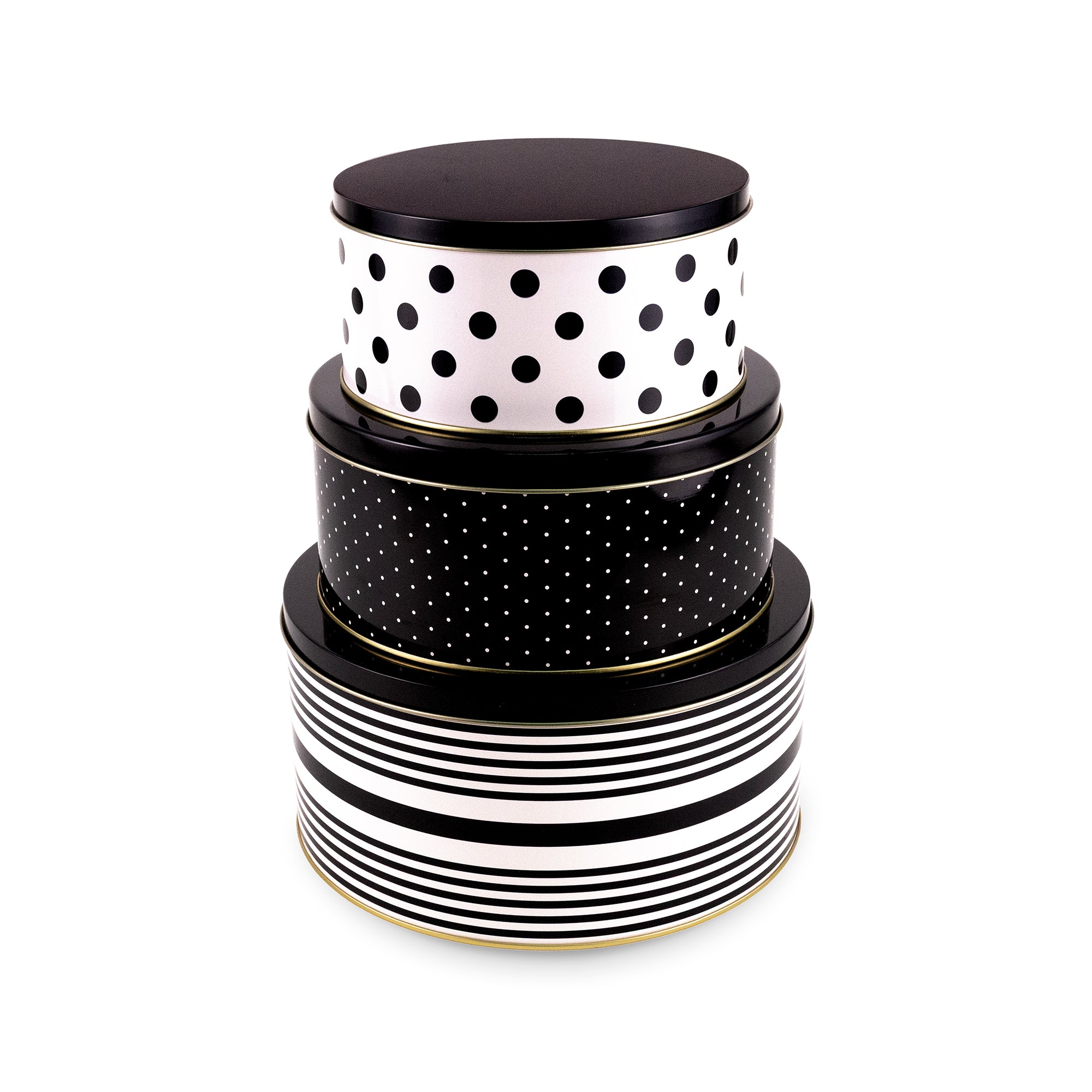 Three nested round storage tins with lids, featuring black and white patterns: the top box is white with black polka dots, the middle box is black with small white dots, and the bottom box has black horizontal stripes on a white background, all with thin gold trim.