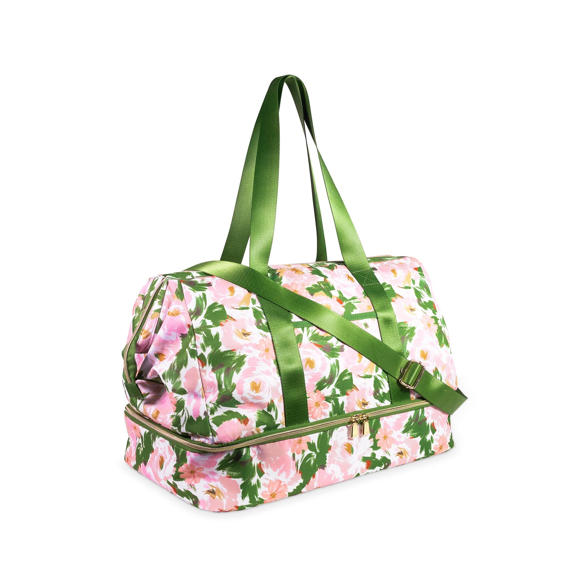 Floral patterned duffel bag with green handles on a white background