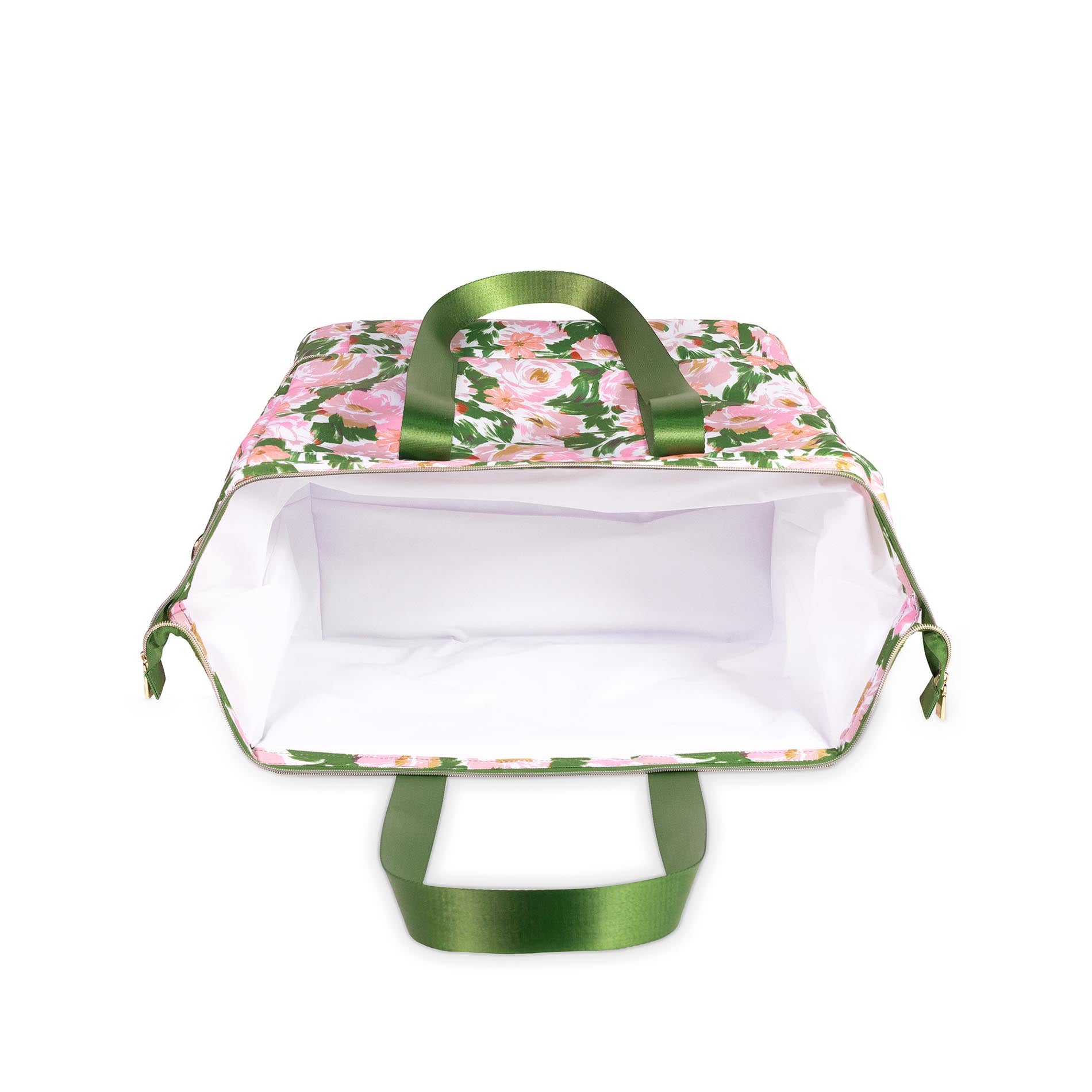 White interior of cooler bag with floral design and green handles on a white background