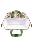 White interior of cooler bag with floral design and green handles on a white background