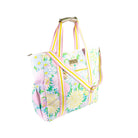 Floral patterned bag with pink straps on a white background