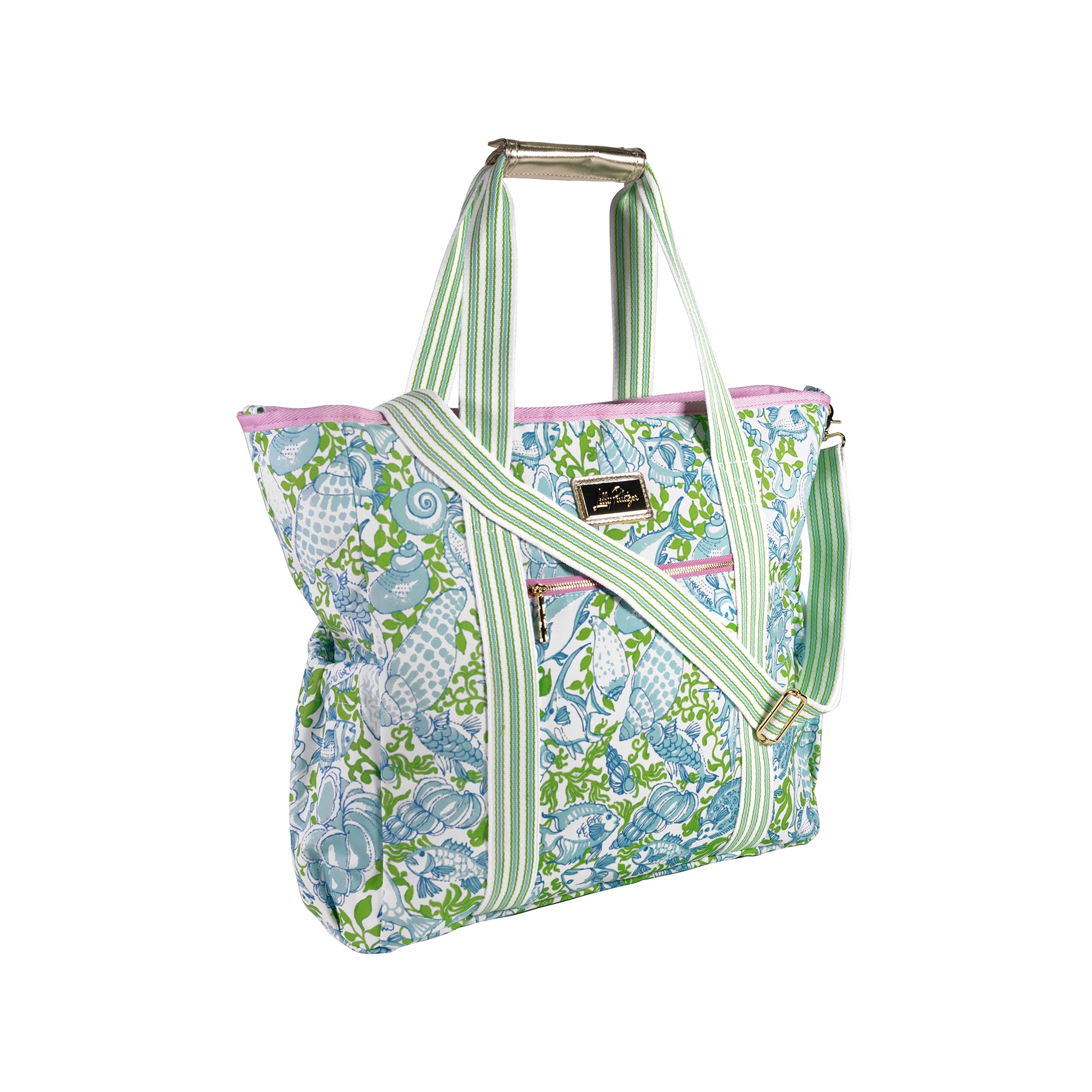 Floral patterned tote bag with green straps on a white background