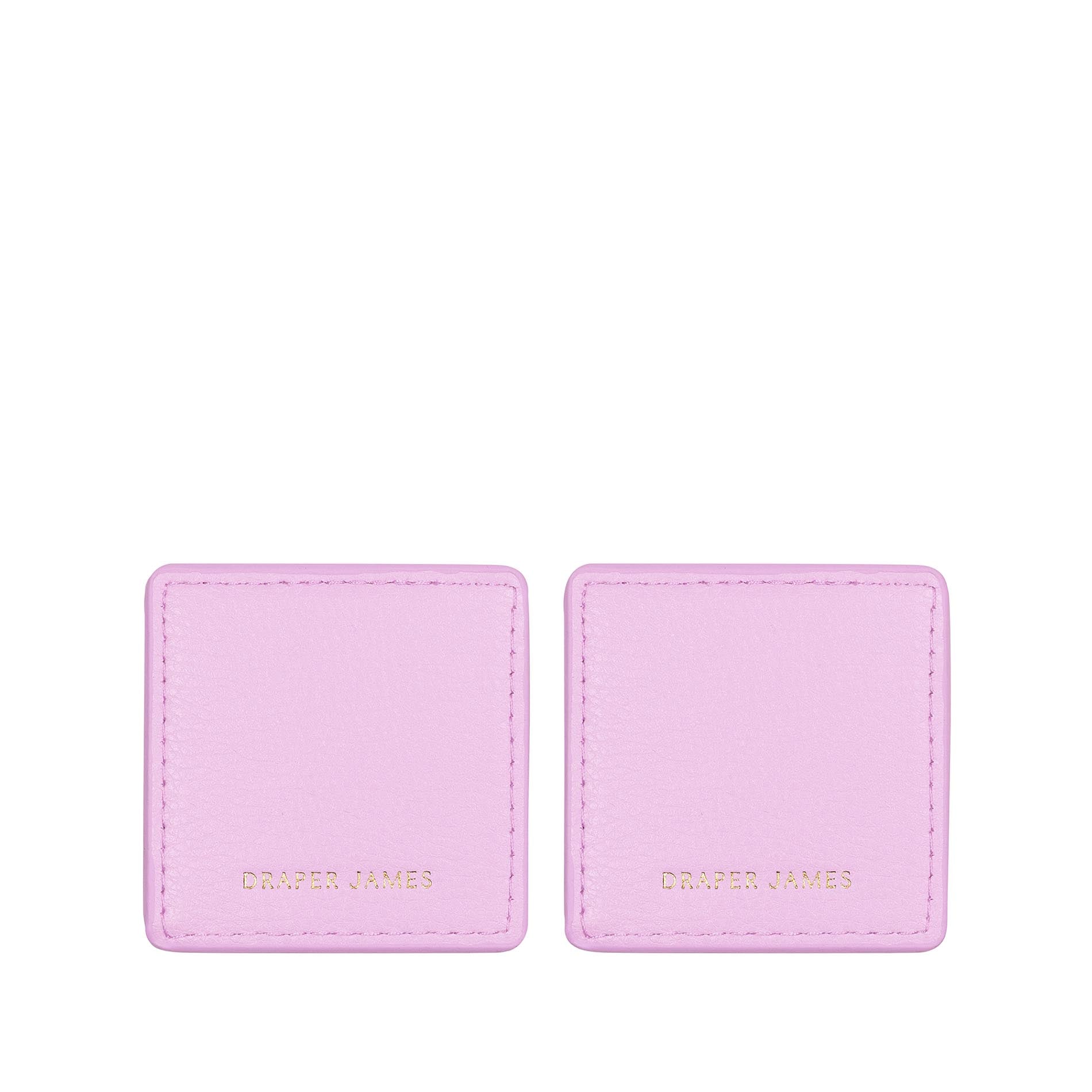 Back view of two pink floral corner bookmarks on a white background