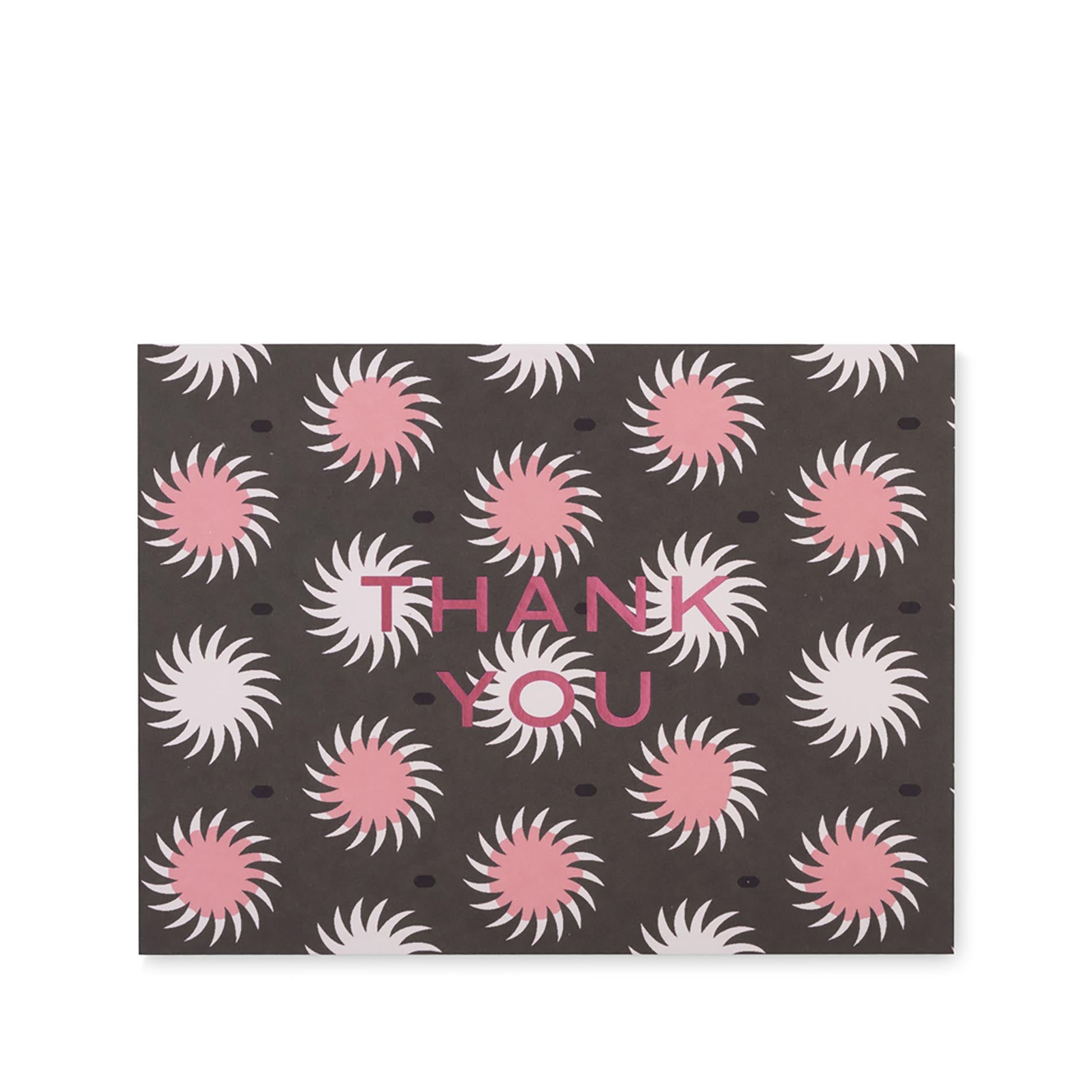 Card with pink and white sunburst pattern and 'Thank You' text on a brown background