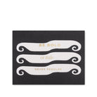Black card with white decorative text and gold lettering on a white background
