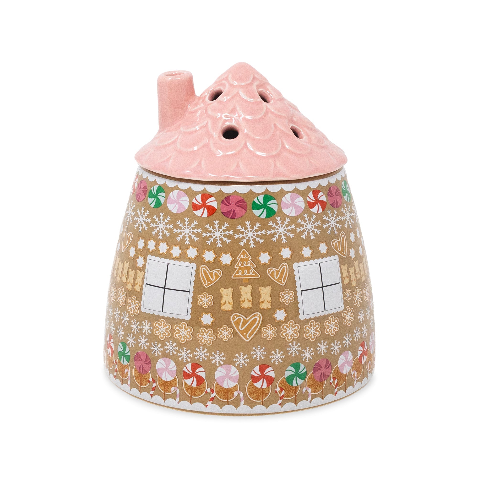 A ceramic gingerbread house-shaped vase with a pink scalloped roof and a decorated body featuring gingerbread cookies, candy canes, snowflakes, and windows on a white background.