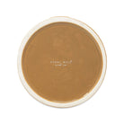 A round ceramic bottom with a glossy warm brown glazed center and a contrasting off-white rim, featuring the brand name 'STEEL MILL and co.' printed in the center.