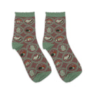 Pair of socks with a pattern of books and teapots on a white background