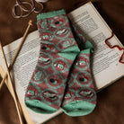 brown book nook socks inside a book
