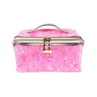 Pink floral patterned cosmetic bag with gold accents on a white background