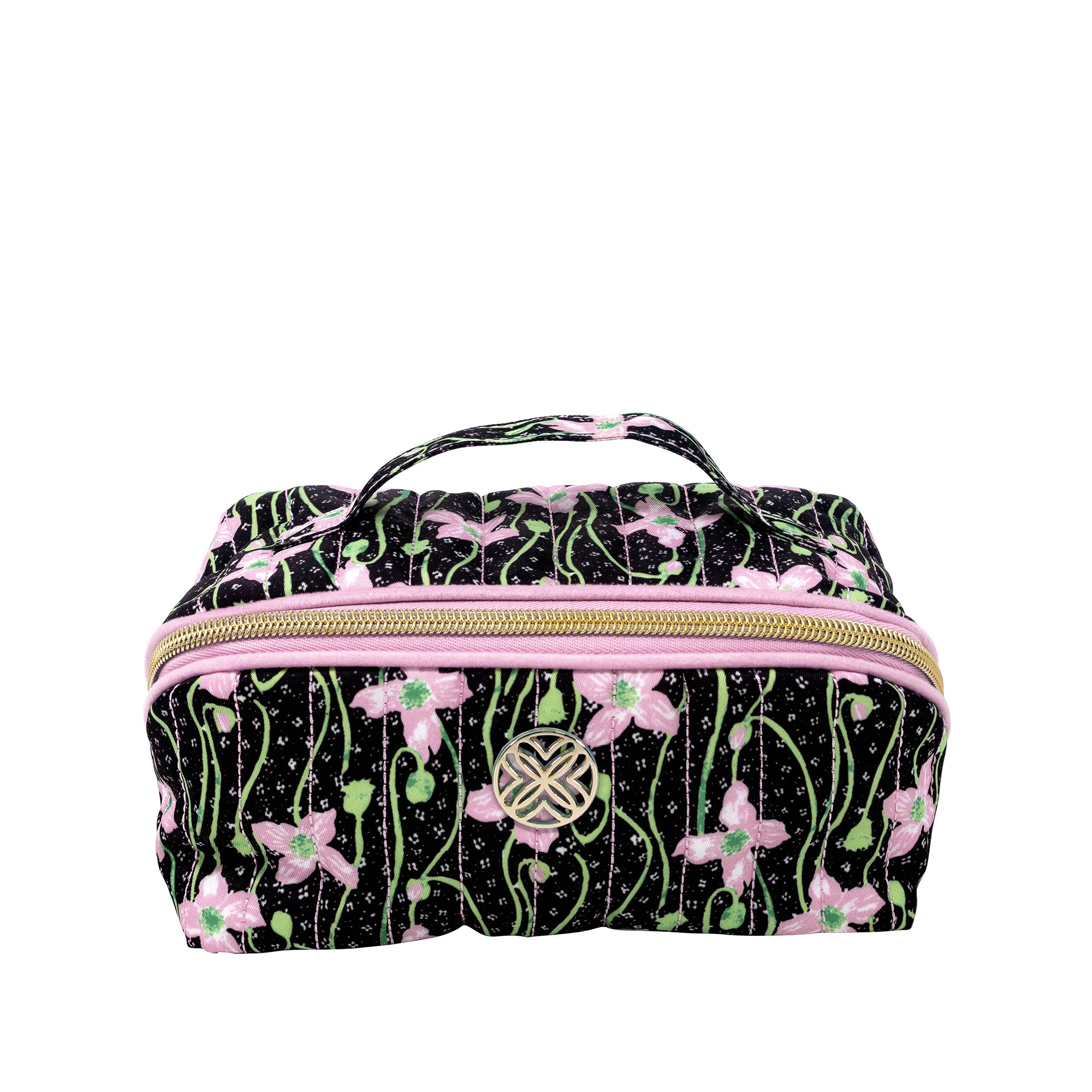 A rectangular zippered cosmetic bag with a black background and a pink, green, and white floral vine pattern. It features a top handle, a gold zipper, and a circular metal logo clasp on the front.