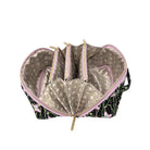 An open makeup bag with a black and pink floral exterior, a light beige patterned interior lining, and multiple zippered compartments, shown on a white background.