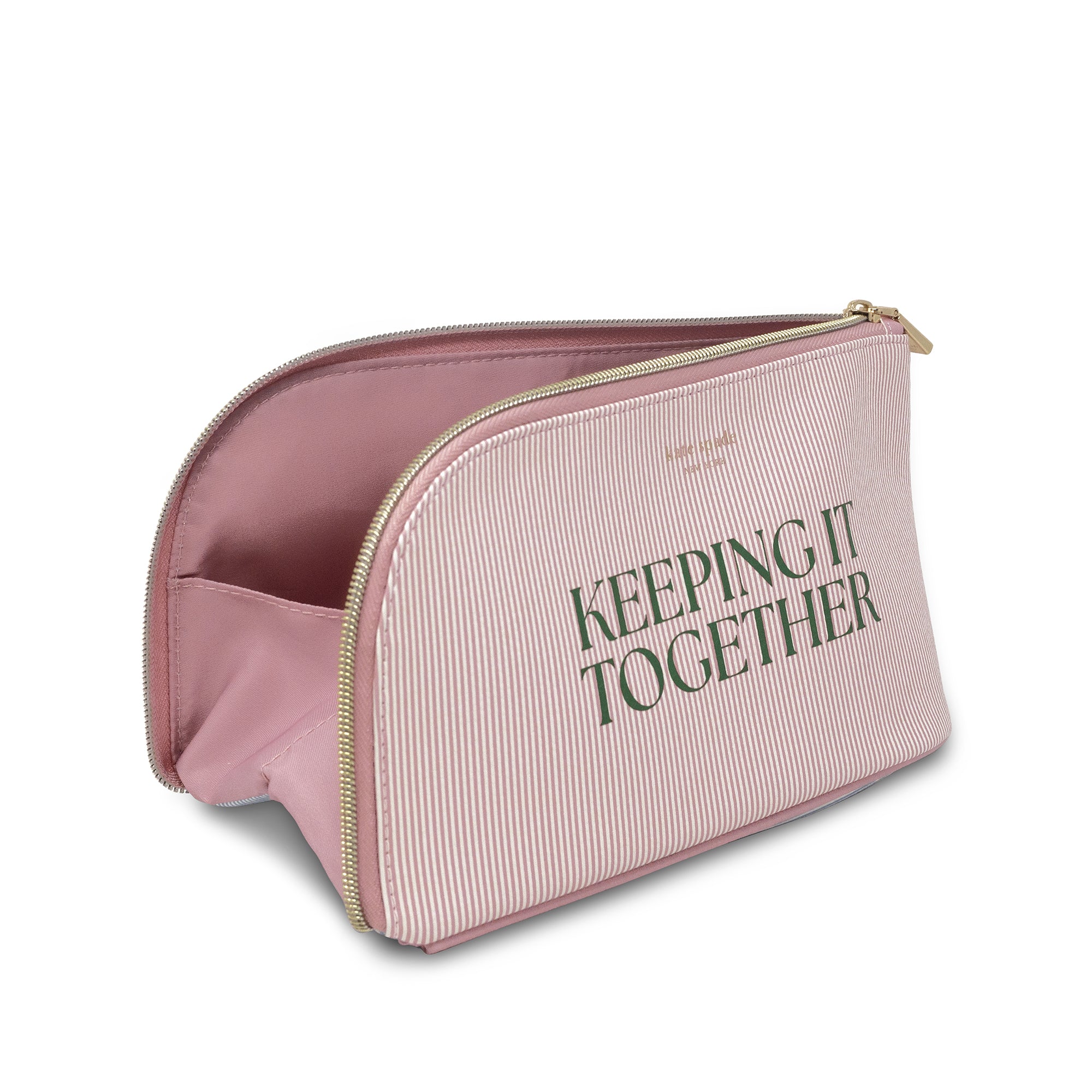 Pink toiletry bag with 'KEEPING IT TOGETHER' text on a white background