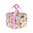 Side view of Floral-patterned dutch over carrier with pink handle on a white background