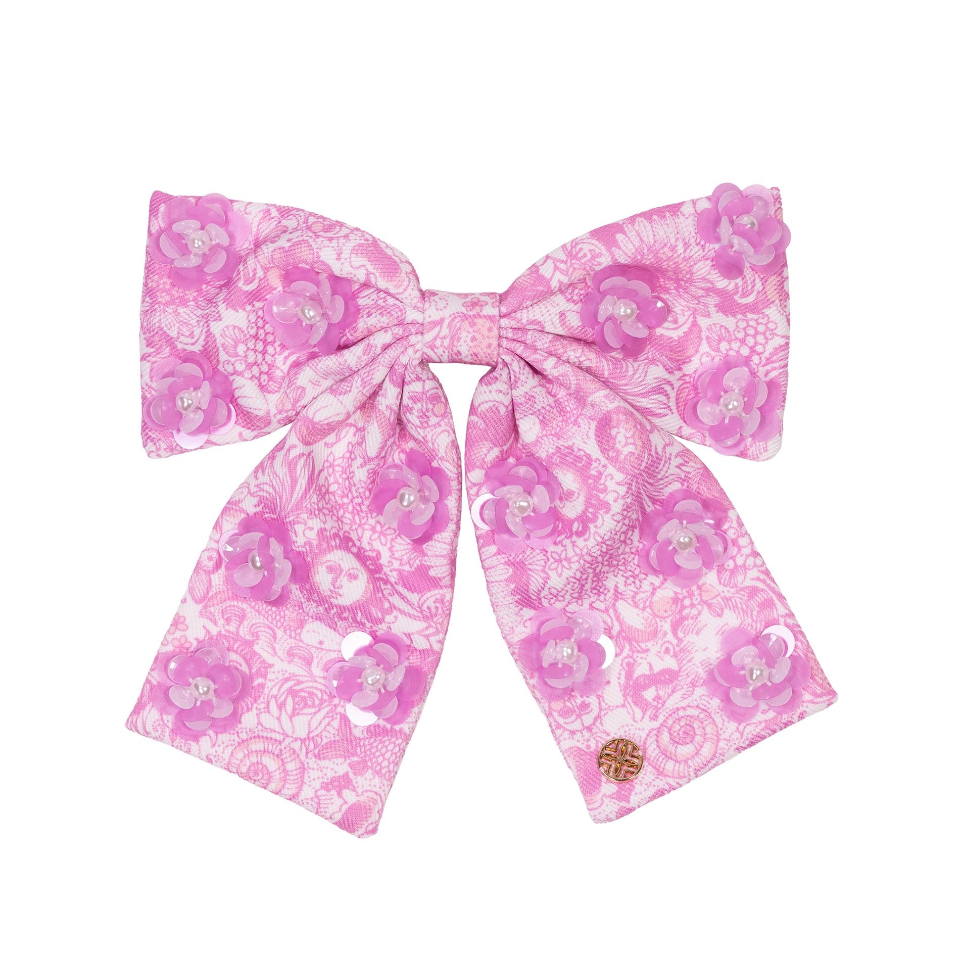 Pink floral bow on a white background