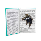 navy and gold accented court wings ornament with gold hanging ribbon, displayed on top of an open book page with a teal text block overlay.