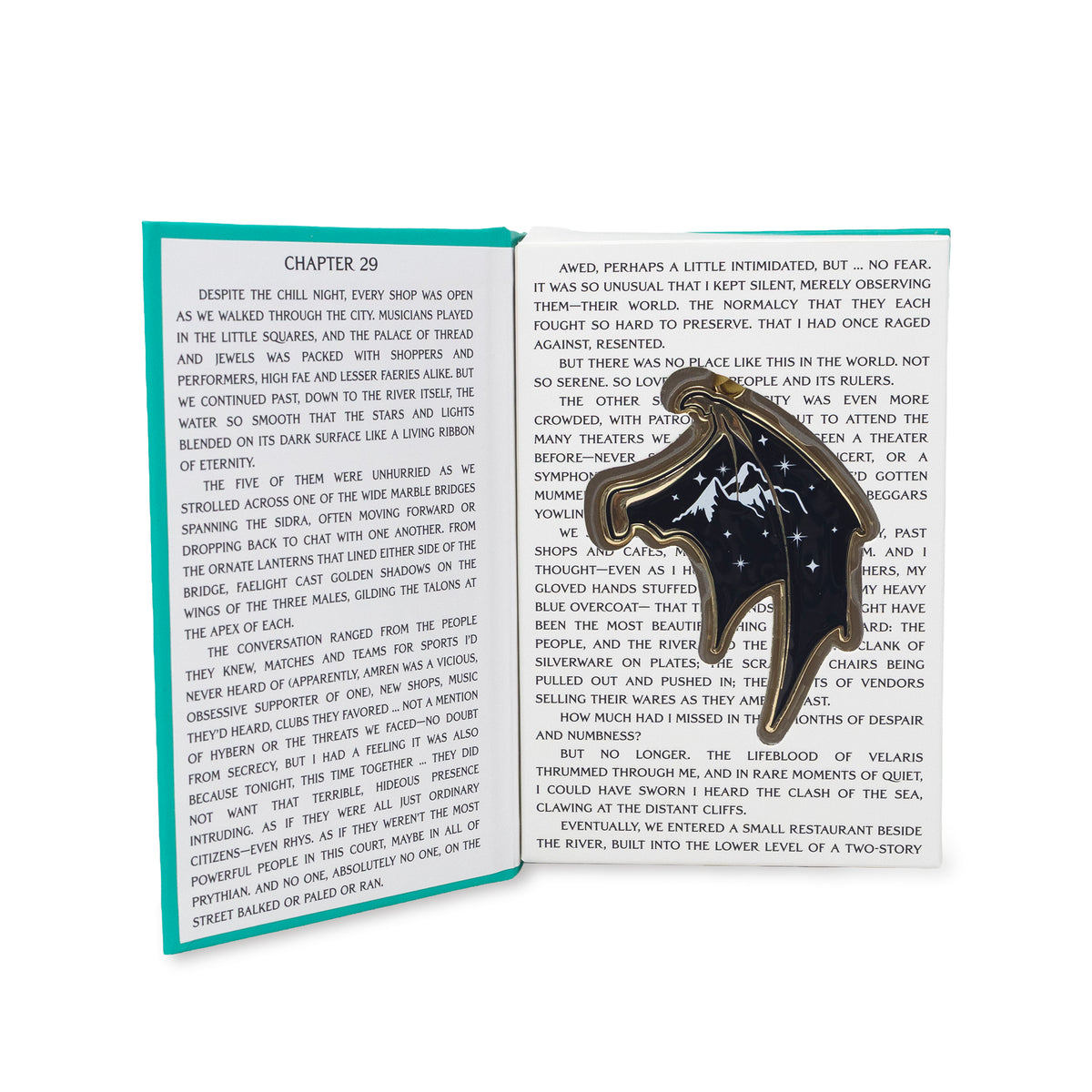 navy and gold accented court wings ornament with gold hanging ribbon, displayed on top of an open book page with a teal text block overlay.