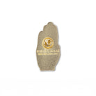 back view of hand enamel pin with a gold-tone metal border and a dark blue background decorated with gold celestial patterns, stars, and a central eye motif.