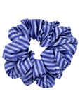 Blue and white striped scrunchie on a white background